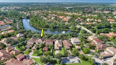 Versatile 4-br, 3-ba Abacoa residence with sparkling LAKE VIEWS on The Club At Admirals Cove Golf Village in Florida - for sale on GolfHomes.com, golf home, golf lot
