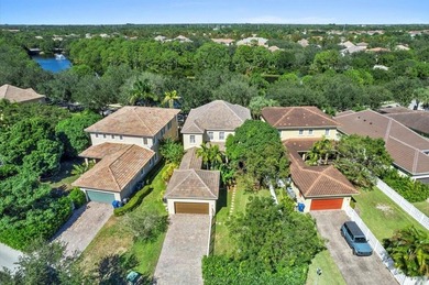 Versatile 4-br, 3-ba Abacoa residence with sparkling LAKE VIEWS on The Club At Admirals Cove Golf Village in Florida - for sale on GolfHomes.com, golf home, golf lot