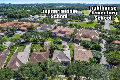 Versatile 4-br, 3-ba Abacoa residence with sparkling LAKE VIEWS on The Club At Admirals Cove Golf Village in Florida - for sale on GolfHomes.com, golf home, golf lot