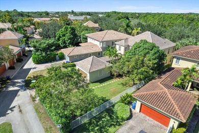 Versatile 4-bedroom, 3-bath Abacoa residence with sparkling LAKE on The Club At Admirals Cove Golf Village in Florida - for sale on GolfHomes.com, golf home, golf lot