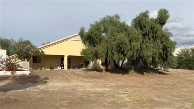 Welcome to this 3 bedroom, 2 bath home perfectly situated on the on Desert Lakes Golf Course in Arizona - for sale on GolfHomes.com, golf home, golf lot