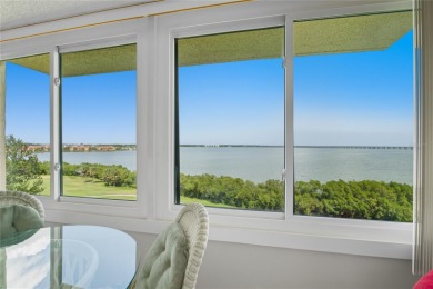 Golf Course. Inside, the living room opens to wide-open water on Cove Cay Country Club in Florida - for sale on GolfHomes.com, golf home, golf lot