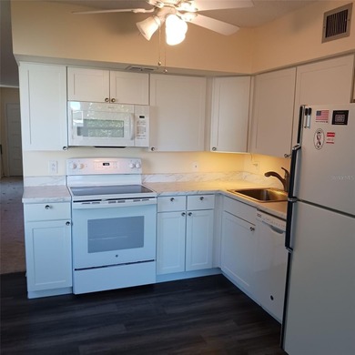 Two bedroom/two bath condo on the second floor across a on On Top Of The World Golf Course in Florida - for sale on GolfHomes.com, golf home, golf lot