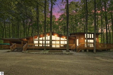 Anchor your Northern Michigan adventures at this architecturally on The Chief Golf Course in Michigan - for sale on GolfHomes.com, golf home, golf lot