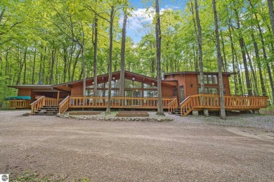 Anchor your Northern Michigan adventures at this architecturally on The Chief Golf Course in Michigan - for sale on GolfHomes.com, golf home, golf lot