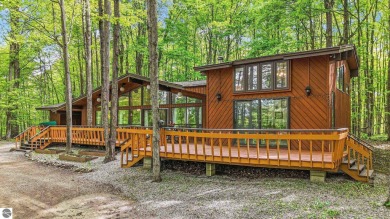 Anchor your Northern Michigan adventures at this architecturally on The Chief Golf Course in Michigan - for sale on GolfHomes.com, golf home, golf lot
