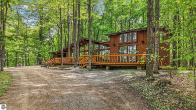 Anchor your Northern Michigan adventures at this architecturally on The Chief Golf Course in Michigan - for sale on GolfHomes.com, golf home, golf lot