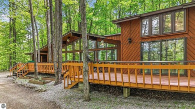 Anchor your Northern Michigan adventures at this architecturally on The Chief Golf Course in Michigan - for sale on GolfHomes.com, golf home, golf lot