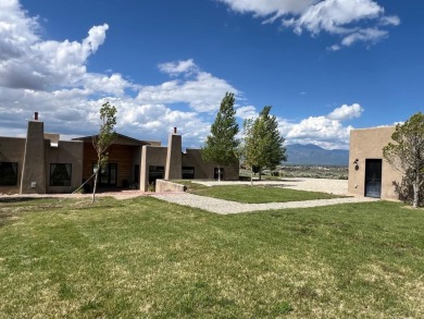 Situated on 6.77 acres spanning three independent parcels (two on Taos Country Club in New Mexico - for sale on GolfHomes.com, golf home, golf lot
