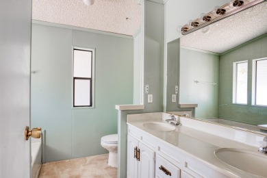 Charming 2-bedroom, 2-bath manufactured home in Palm Desert's on Portola Country Club in California - for sale on GolfHomes.com, golf home, golf lot