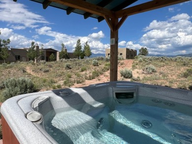 Situated on 6.77 acres spanning three independent parcels (two on Taos Country Club in New Mexico - for sale on GolfHomes.com, golf home, golf lot