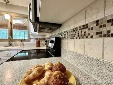 Charming Nantucket-style 3BR/2BA home in the gated lake & golf on Carolina Lakes Country Club in North Carolina - for sale on GolfHomes.com, golf home, golf lot