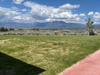 Situated on 6.77 acres spanning three independent parcels (two on Taos Country Club in New Mexico - for sale on GolfHomes.com, golf home, golf lot