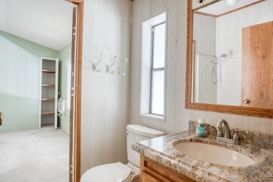 Charming 2-bedroom, 2-bath manufactured home in Palm Desert's on Portola Country Club in California - for sale on GolfHomes.com, golf home, golf lot