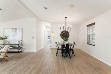 A clean, bright, and inviting manufactured home offering on Lakes of Lady Lake Golf Course in Florida - for sale on GolfHomes.com, golf home, golf lot