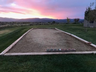 Situated on 6.77 acres spanning three independent parcels (two on Taos Country Club in New Mexico - for sale on GolfHomes.com, golf home, golf lot