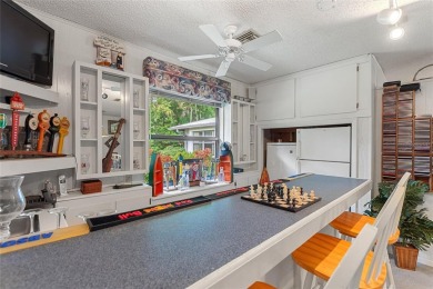 Charming Canal-Front Home on a Full Acre in Indian Lake Estates! on Indian Lake Estates Golf and Country Club in Florida - for sale on GolfHomes.com, golf home, golf lot