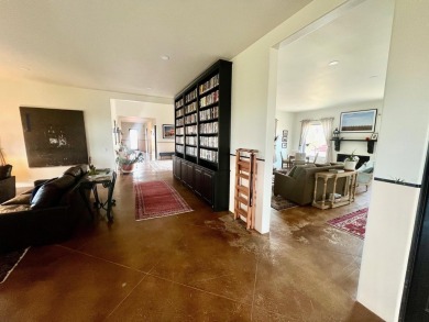 Situated on 6.77 acres spanning three independent parcels (two on Taos Country Club in New Mexico - for sale on GolfHomes.com, golf home, golf lot