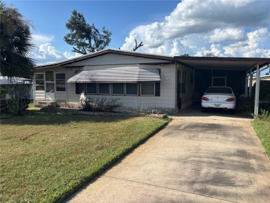 Spacious 2-bedroom, 2-bath home on a large corner lot with over on Zellwood Station Country Club in Florida - for sale on GolfHomes.com, golf home, golf lot