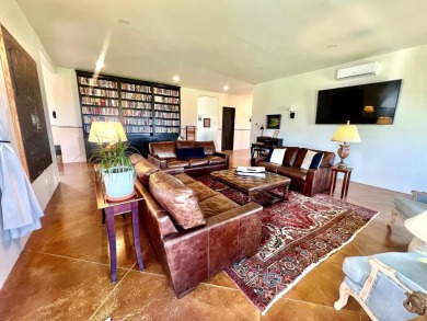 Situated on 6.77 acres spanning three independent parcels (two on Taos Country Club in New Mexico - for sale on GolfHomes.com, golf home, golf lot