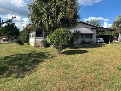 Spacious 2-bedroom, 2-bath home on a large corner lot with over on Zellwood Station Country Club in Florida - for sale on GolfHomes.com, golf home, golf lot