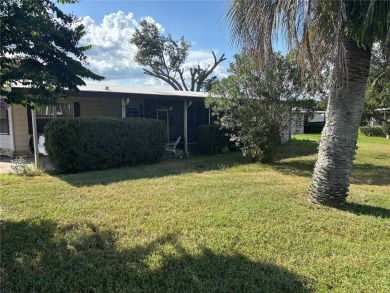 Spacious 2-bedroom, 2-bath home on a large corner lot with over on Zellwood Station Country Club in Florida - for sale on GolfHomes.com, golf home, golf lot