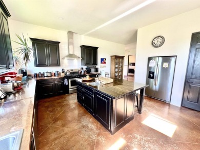 Situated on 6.77 acres spanning three independent parcels (two on Taos Country Club in New Mexico - for sale on GolfHomes.com, golf home, golf lot
