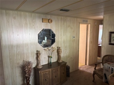 Spacious 2-bedroom, 2-bath home on a large corner lot with over on Zellwood Station Country Club in Florida - for sale on GolfHomes.com, golf home, golf lot