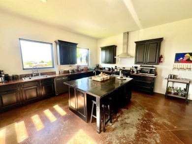 Situated on 6.77 acres spanning three independent parcels (two on Taos Country Club in New Mexico - for sale on GolfHomes.com, golf home, golf lot