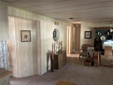 Spacious 2-bedroom, 2-bath home on a large corner lot with over on Zellwood Station Country Club in Florida - for sale on GolfHomes.com, golf home, golf lot