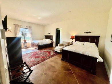 Situated on 6.77 acres spanning three independent parcels (two on Taos Country Club in New Mexico - for sale on GolfHomes.com, golf home, golf lot