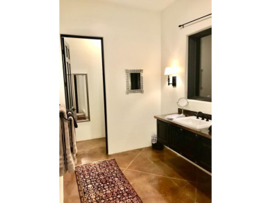 Situated on 6.77 acres spanning three independent parcels (two on Taos Country Club in New Mexico - for sale on GolfHomes.com, golf home, golf lot