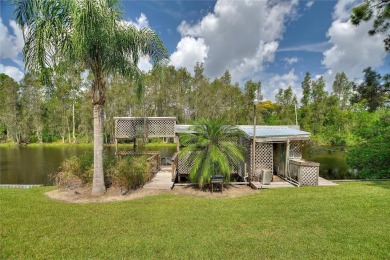 Charming Canal-Front Home on a Full Acre in Indian Lake Estates! on Indian Lake Estates Golf and Country Club in Florida - for sale on GolfHomes.com, golf home, golf lot