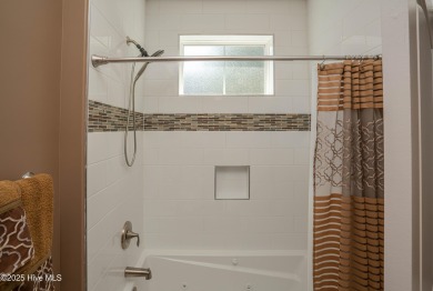 Welcome to this stunning custom-built home in Ocean Ridge on Ocean Ridge Plantation in North Carolina - for sale on GolfHomes.com, golf home, golf lot