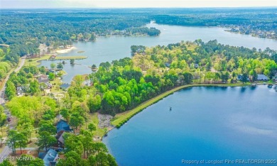 Charming Nantucket-style 3BR/2BA home in the gated lake & golf on Carolina Lakes Country Club in North Carolina - for sale on GolfHomes.com, golf home, golf lot
