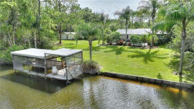Charming Canal-Front Home on a Full Acre in Indian Lake Estates! on Indian Lake Estates Golf and Country Club in Florida - for sale on GolfHomes.com, golf home, golf lot