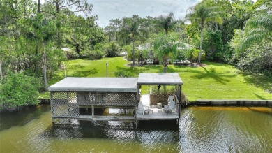 Charming Canal-Front Home on a Full Acre in Indian Lake Estates! on Indian Lake Estates Golf and Country Club in Florida - for sale on GolfHomes.com, golf home, golf lot