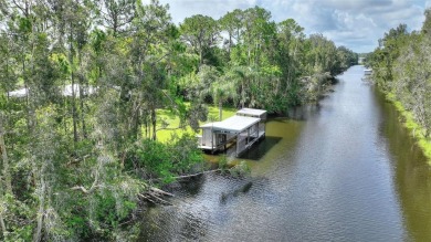 Charming Canal-Front Home on a Full Acre in Indian Lake Estates! on Indian Lake Estates Golf and Country Club in Florida - for sale on GolfHomes.com, golf home, golf lot
