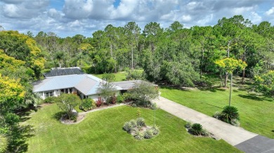 Charming Canal-Front Home on a Full Acre in Indian Lake Estates! on Indian Lake Estates Golf and Country Club in Florida - for sale on GolfHomes.com, golf home, golf lot