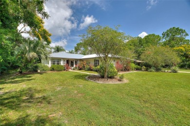 Charming Canal-Front Home on a Full Acre in Indian Lake Estates! on Indian Lake Estates Golf and Country Club in Florida - for sale on GolfHomes.com, golf home, golf lot