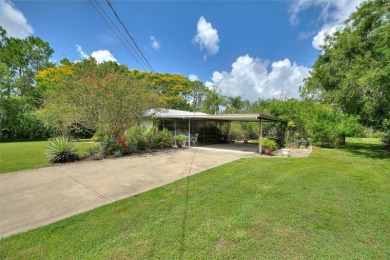 Charming Canal-Front Home on a Full Acre in Indian Lake Estates! on Indian Lake Estates Golf and Country Club in Florida - for sale on GolfHomes.com, golf home, golf lot