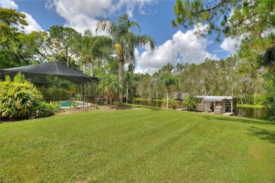 Charming Canal-Front Home on a Full Acre in Indian Lake Estates! on Indian Lake Estates Golf and Country Club in Florida - for sale on GolfHomes.com, golf home, golf lot