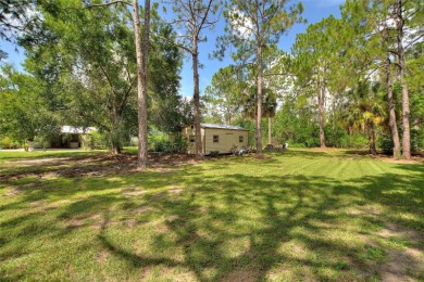 Charming Canal-Front Home on a Full Acre in Indian Lake Estates! on Indian Lake Estates Golf and Country Club in Florida - for sale on GolfHomes.com, golf home, golf lot