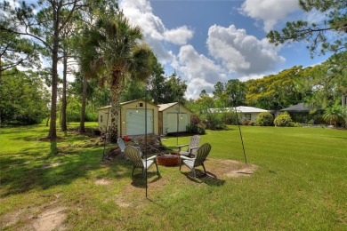 Charming Canal-Front Home on a Full Acre in Indian Lake Estates! on Indian Lake Estates Golf and Country Club in Florida - for sale on GolfHomes.com, golf home, golf lot