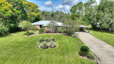 Charming Canal-Front Home on a Full Acre in Indian Lake Estates! on Indian Lake Estates Golf and Country Club in Florida - for sale on GolfHomes.com, golf home, golf lot