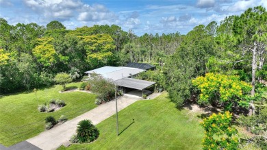 Charming Canal-Front Home on a Full Acre in Indian Lake Estates! on Indian Lake Estates Golf and Country Club in Florida - for sale on GolfHomes.com, golf home, golf lot