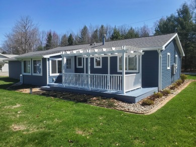 Charming ranch style home situated on the 15th hole of White on White Deer Country Club in Michigan - for sale on GolfHomes.com, golf home, golf lot