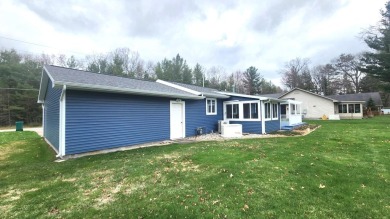 Charming ranch style home situated on the 15th hole of White on White Deer Country Club in Michigan - for sale on GolfHomes.com, golf home, golf lot