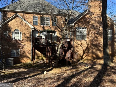 This solid 4-sided brick home is on the 14th hole of the fairway on Canongate On White Oak Golf Course in Georgia - for sale on GolfHomes.com, golf home, golf lot