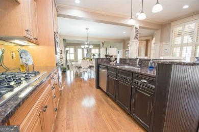 Step into luxury at this 4-bedroom, 4-bathroom cottage in Newnan on Summergrove Golf Club in Georgia - for sale on GolfHomes.com, golf home, golf lot